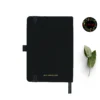 Black fabric-covered notebook with rounded corners, matching black elastic band, pen loop, and dual ribbon bookmarks, displayed with a red fountain pen and a floral 'joie' logo