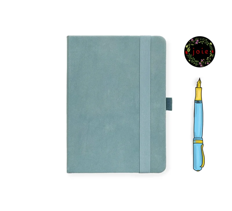 Light blue leather-covered notebook with rounded corners, matching elastic band, and pen loop, paired with an illustrated blue and yellow fountain pen and a floral 'joie' logo.