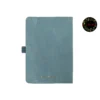 Light blue leather-covered notebook with rounded corners, matching elastic band, and pen loop, paired with an illustrated blue and yellow fountain pen and a floral 'joie' logo.