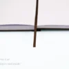 Stylish dark brown cloth notebook featuring smooth rounded corners, matching dark brown elastic closure, pen holder, and two elegant dark brown silk ribbons