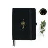Compass A5 dot grid notebook with black cover and gold illustration