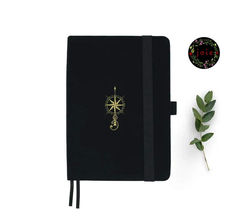 Compass A5 dot grid notebook with black cover and gold illustration