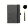 Dark grey leather-textured fabric notebook with rounded corners, matching elastic band, pen loop, and dual ribbon bookmarks, shown with a green and yellow fountain pen illustration and a floral 'joie' logo