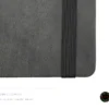 Dark grey leather-textured fabric notebook with rounded corners, matching elastic band, pen loop, and dual ribbon bookmarks, shown with a green and yellow fountain pen illustration and a floral 'joie' logo