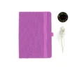 Pink A5 fabric dot grid notebook with elastic band, pen loop, Joie logo, and dried flowers – perfect for journaling and planning