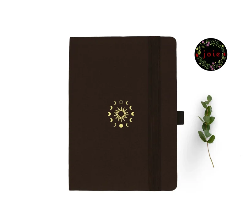 A5 dot grid notebook with sun and moon design on cover