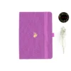 A5 dot grid notebook with unicorn illustration and elastic band