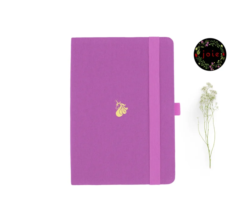 A5 dot grid notebook with unicorn illustration and elastic band